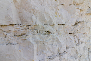 Chalk cliff with multiple cracks
