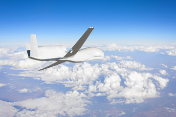 Unmanned aerial vehicle flying high in the sky above the clouds in the upper atmosphere, mission. Elements of this image furnished by NASA.