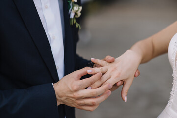 Obraz na płótnie Canvas marriage, wedding ceremony, exchange of rings close-up