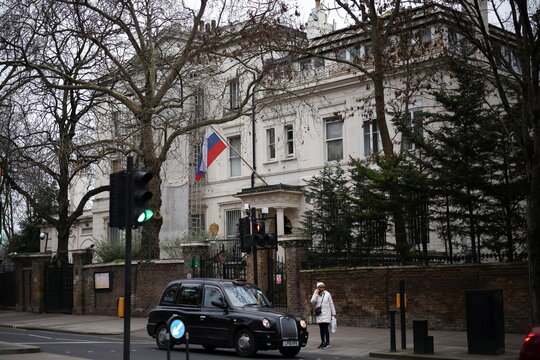 A London taxi passes in front of the Russian embassy in London