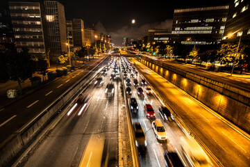 Barcelona, 2018: Cars driving at night at Barcelona highway. City traffic.