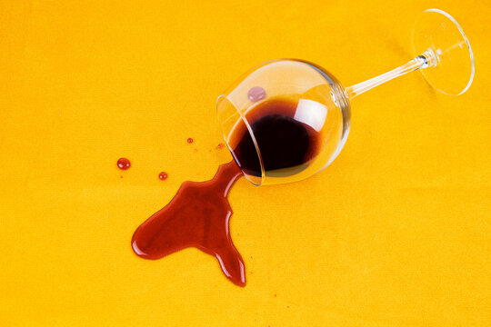 A Spilled Glass Of Wine On The Tablecloth. Cleaning Clothes And Furniture From Stains.