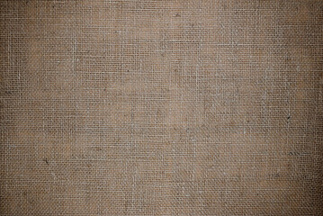 Abstract background. Burlap texture close up. Rustic coarse linen fabric.