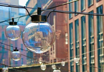 City scape of building reflections in a glass globe.