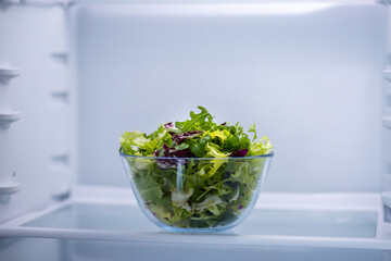 fresh salad in a glass bowl
