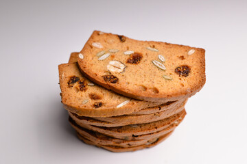 Rusks with fruit, close-up, isolated on white background.  Traditional biscuit tray with fruit, toasts for breakfast and cup of fresh milk and Tea. 