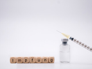 Vaccine bottle and syringe with German letters 