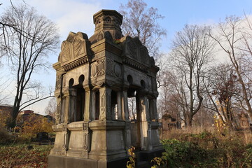 Obraz premium Old crypt at the Nikolsky cemetery of the Alexander Nevsky Lavra in Saint Petersburg, Russia. Burial place was founded in 1861, now is active and freely accessible at the present time.