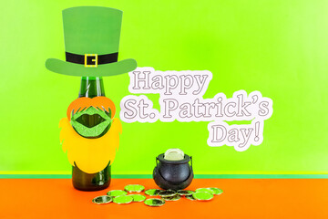 St. Patricks day concept - green beer and symbols, green and orange background. Party invitation.