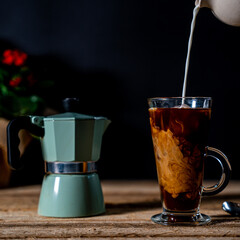 Milk Pouring into Coffee
