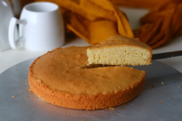 Slice of ghee cake. A version of tea cake with ghee and flavoured with cardamom. Perfect with a cup of hot tea.