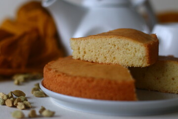 Slice of ghee cake. A version of tea cake with ghee and flavoured with cardamom. Perfect with a cup of hot tea.