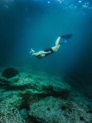 Fototapeta na wymiar Women underwater snorkling