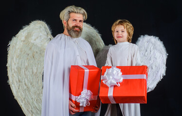 Valentines angels with present. Happy father and son with gift box. Valentine cupid with white...
