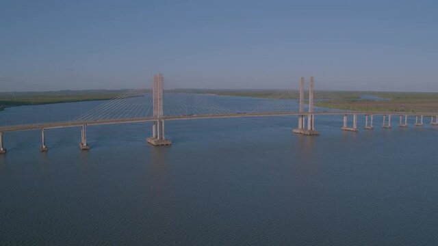 open plan aerial view of the Jo&atilde;o Alves bridge on the Sergipe river in the city of aracaju with motion approaching as cars pass on the bridge