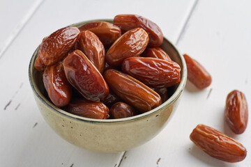 dates food in a bowl on white background