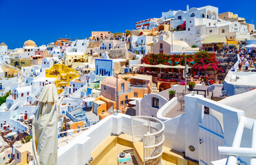 Romantic time on famous Santorini island resort. Oia town at sunny day time, traditional greek...