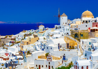 Romantic time on famous Santorini island resort. Oia town at sunny day time, traditional greek...