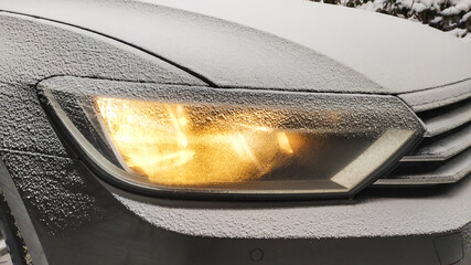 Light of a car headlight in the snow