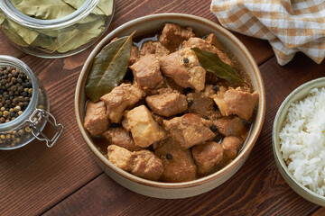 traditional filipino food pork adobo garlic vinegar soy sauce steamed rice bay leaves mix of pepper