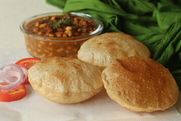 Whole wheat puris served with black eyed beans or cowpea beans gravy as side dish