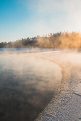 Obraz na płótnie Canvas Winter sunset at a lake in Finland