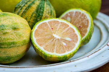 Fresh ripe bergamot citrus fruit and pink tiger lemons - obrazy, fototapety, plakaty