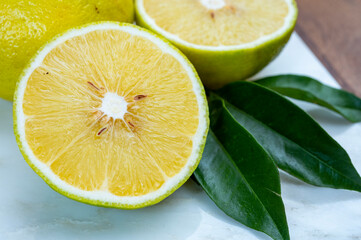 Fresh ripe bergamot citrus fruit used for aromatherapy, parfumerie and for earl-grey tea - obrazy, fototapety, plakaty