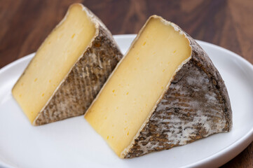 Fototapeta premium French mountain cheese from Alps, tomme de Savoie