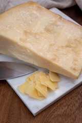 Flakes of parmesan cheese, italian hard parmigiano-reggiano cheese from Reggio Emilia region