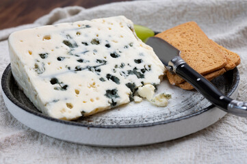 Tastig of French king of cheeses, sheep milk blue cheese roquefort from Southern France,