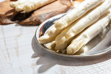 New harvest of high quality Dutch white asparagus washed, uncooked, tasty vegetarian dinner