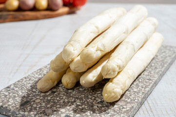 New harvest of high quality Dutch white asparagus washed, uncooked