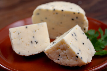 Traditional polish white cheese with black chives seeds made in North Poland in Kaszebe area near Gdynia.