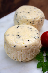 Traditional polish white cheese with black chives seeds made in North Poland in Kaszebe area near...