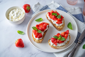 Strawberry ricotta sandwiches with mint leaves
