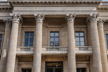 Architectural fragment of the facade of the military school (Ecole Militaire) founded in 1750 in Paris. Central building. Paris, France. 