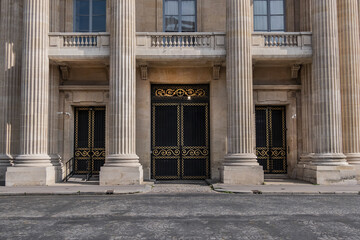 Architectural fragment of the facade of the military school (Ecole Militaire) founded in 1750 in Paris. Central building. Paris, France. 