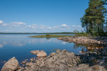 Fototapeta premium Rocky shore of Lake Panozero on sunny summer day, Karelia, Russia