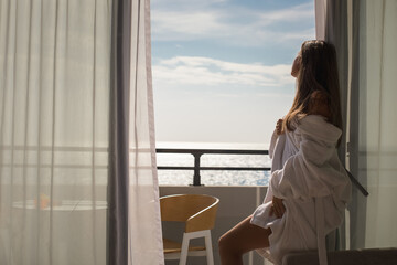 Shot of beautiful young woman in white robe