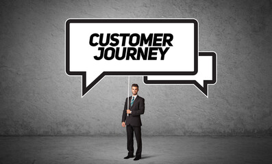 Fototapeta premium business person in casual holding road sign