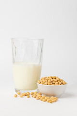 High protein product soybeans is popular ingredient for variant of vegetable milk. Dry, raw soybean, soy bean, or soya bean  one of types asian legume in boul  white background.