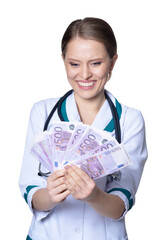 Portrait of female doctor holding money on white background