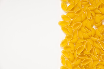 Close up of several types of dry pasta on white background