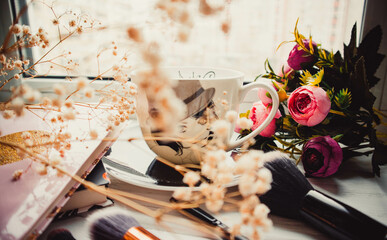 Cup of coffee and makeup brushes on wood white background with handbag