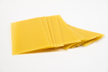 raw pasta for lasagna on white background