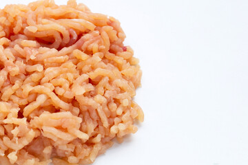 Minced meat of chicken fillet on white background.