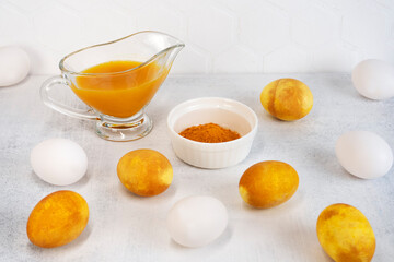 Yellow and white Easter eggs. Natural coloring Easter eggs with turmeric powder in yellow color.