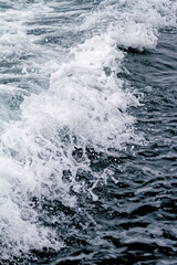 Fototapeta na wymiar Boat Wave ocean trace on blue sea fresh water background