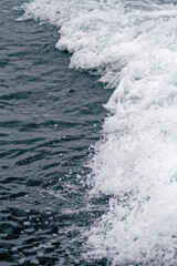 Fototapeta na wymiar Boat Wave ocean trace on blue sea fresh water background